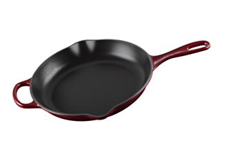 A Le Creuset Signature Skillet 10.25 in Rhone Dark Red over a white background.