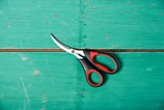 A pair of RSVP Endurance Seafood Shears sits on a turquoise wood table. 