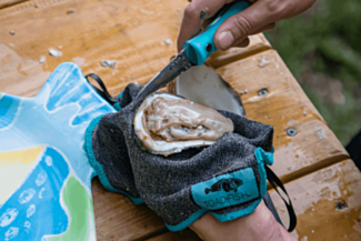 Toadfish Outfitters Put ‘Em Back™ Cut-Proof Shucking Cloth in use